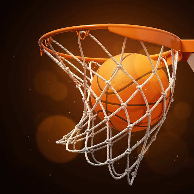 Ein Basketballkorb durch den grade ein Basketball fliegt.
